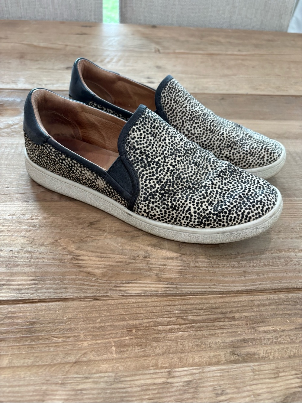 Women’s UGG Slip-On Sneakers in Black and White Animal Print